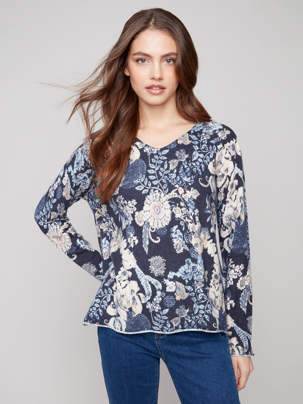 Sweater with a plushy yarn texture and colorful floral pattern, featuring long sleeves for added warmth by Charlie B.