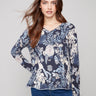 Sweater with a plushy yarn texture and colorful floral pattern, featuring long sleeves for added warmth by Charlie B.