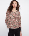 Patterned top with a V-neck design, perfect for casual outings. The paisley pattern adds a stylish touch to your wardrobe. By Charlie B.