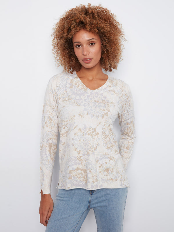 Sweater with side slits at cuffs and hem, featuring a delicate abstract print in soft hues by Charlie B.