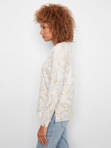 Elegant long-sleeve sweater featuring a relaxed fit and artistic abstract motifs by Charlie B.