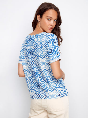 Back view of the blue patterned shirt highlighting the intricate design and relaxed fit, ideal for everyday wear by Charlie B.