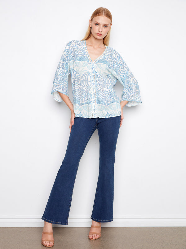 Showcasing wide 3/4 sleeves, this top offers comfort and style. Its flowing silhouette enhances its casual charm by Charlie B.