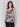 Black and white top with crew neckline, showcasing abstract botanical print by Charlie B.