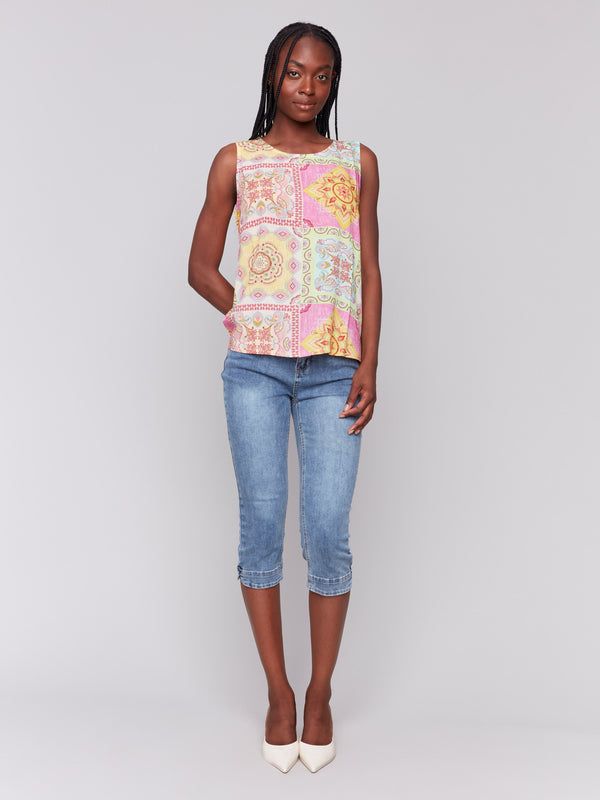 Top featuring keyhole back with button closure and bold patterns by Charlie B.