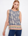 Top with a blue mural graphic print, showcasing a sleeveless design and intricate border detail by Charlie B.