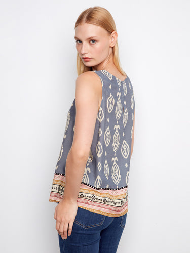 Retro floral print top exuding vibrancy with its unique sleeveless design and chic style by Charlie B.