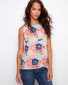 Floral top featuring a crew neckline and vibrant colors, perfect for a casual day out. Designed by Charlie B.