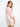 Chic blouse in abstract pink and white pattern, highlighted by its elegant v-neckline and relaxed silhouette by Charlie B.