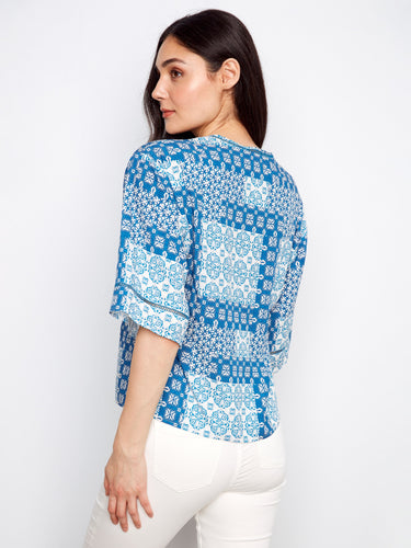 Stylish blue top with intricate patterns, offering comfort and flair in its relaxed fit by Charlie B.
