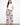 Floral pants with a self belt tie, offering a chic and adjustable fit. Perfect for any occasion. By Charlie B.