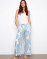 Wide-leg pants with a self-tie belt and a lush abstract print, perfect for casual outings by Charlie B.