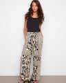 These pants feature a wide leg design, adding a flowy and relaxed look to your outfit. By Charlie B.