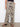 These patterned wide-leg trousers are perfect for casual outings or lounging in style. By Charlie B.
