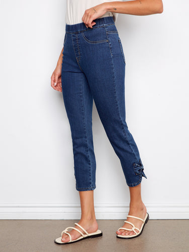Cropped length stretch denim pants designed with two faux front pockets and two back pockets by Charlie B.