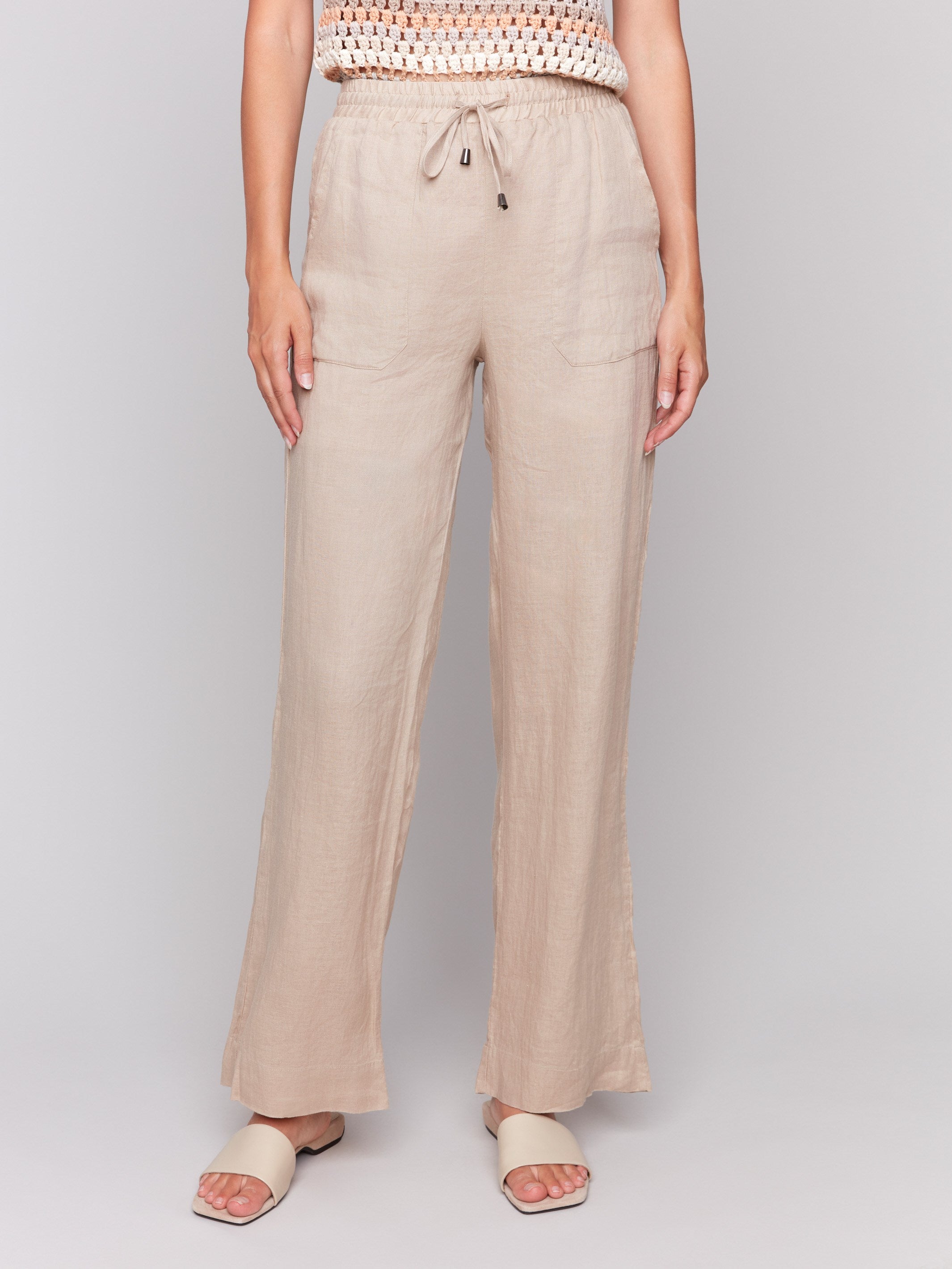Biscuit-colored pants featuring a regular rise by Charlie B.