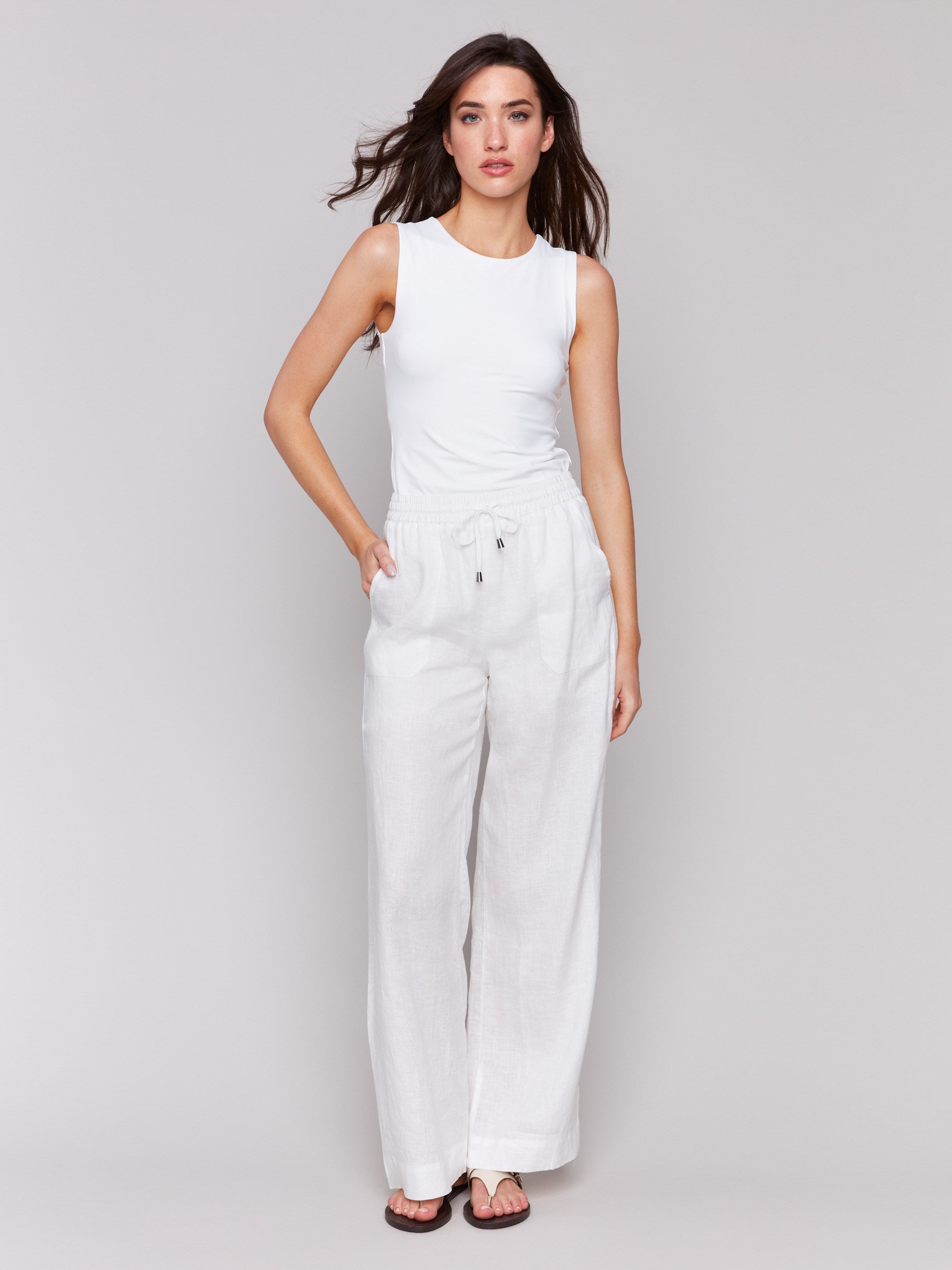 White pants with a wide leg fit and regular rise by Charlie B.