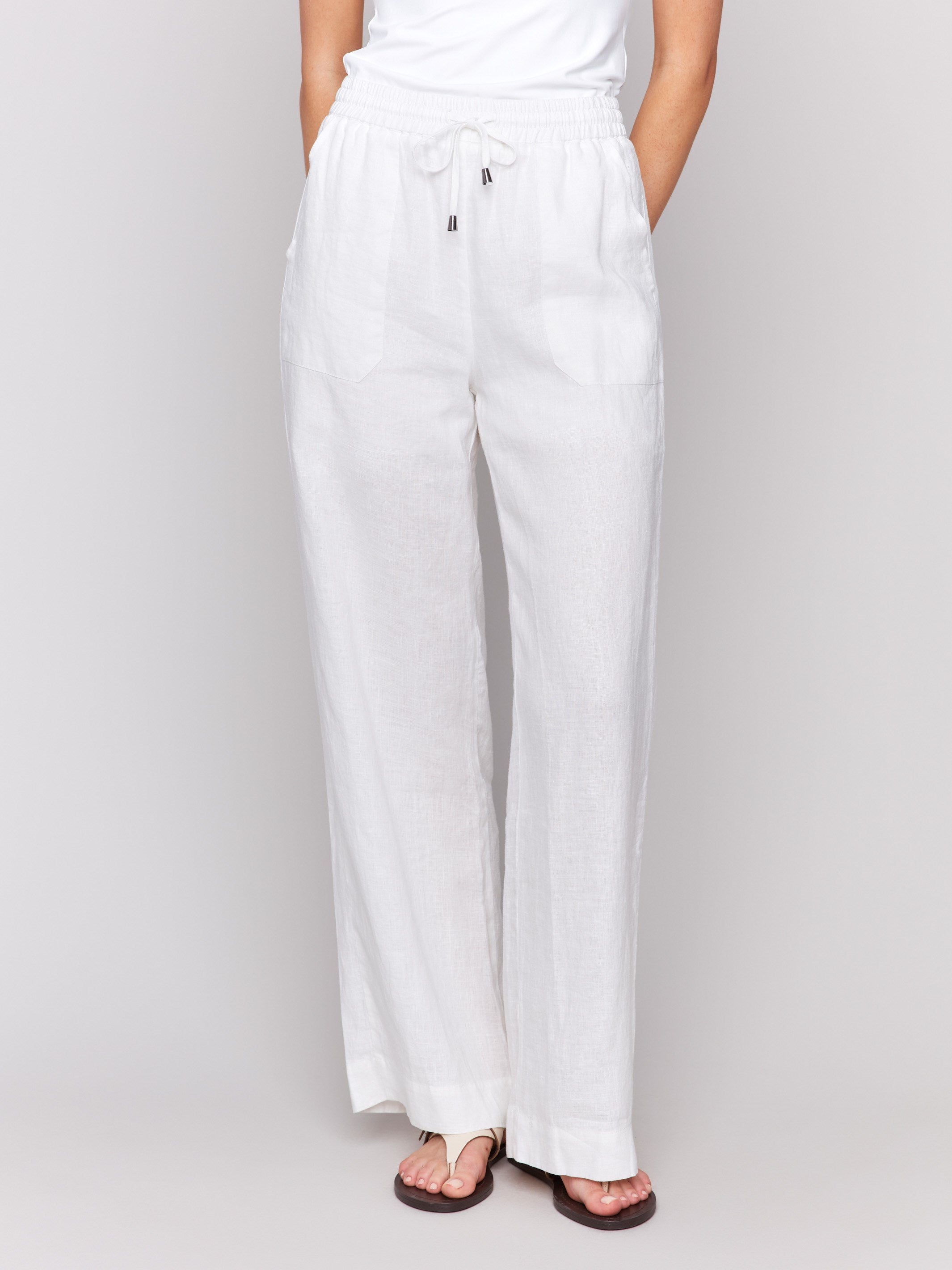 Pants featuring a front tie waistband in white by Charlie B.