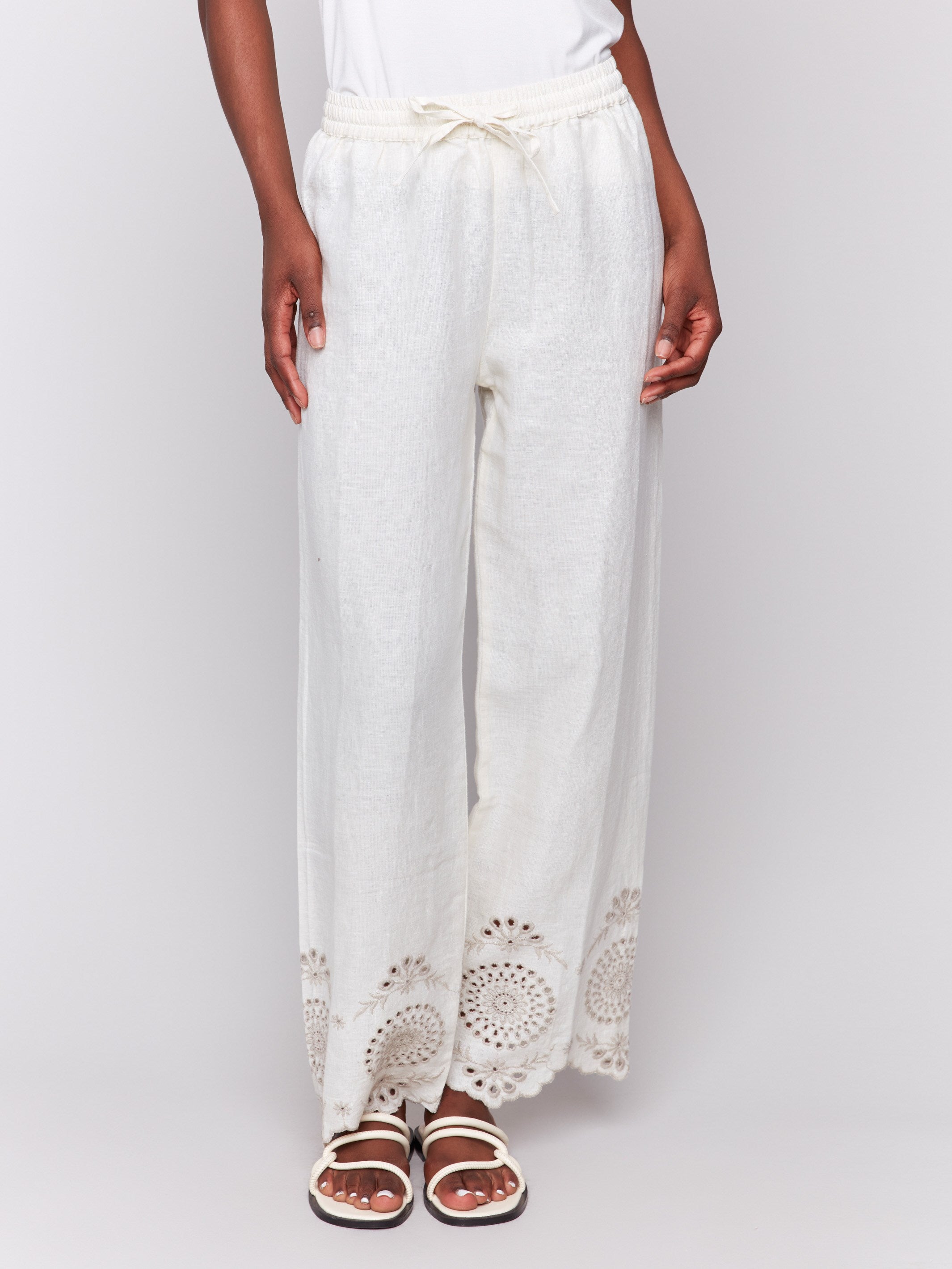 Natural linen trousers showcasing back patch pockets for added style by Charlie B.