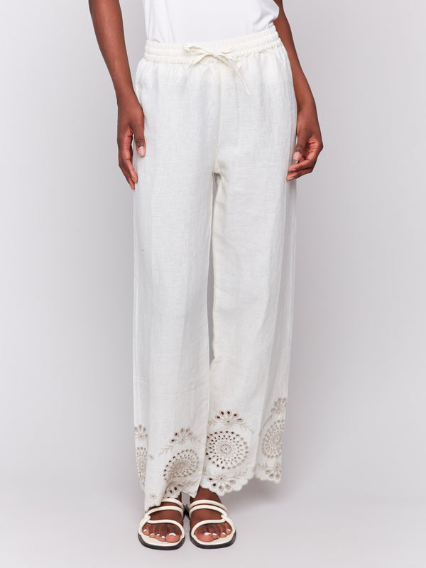 Natural linen trousers showcasing back patch pockets for added style by Charlie B.