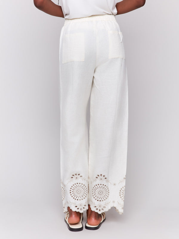 Long length linen pants featuring elegant eyelet embroidery detail by Charlie B.