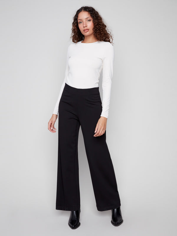 Featuring a comfortable elastic waistband, these black pants ensure ease and style by Charlie B.
