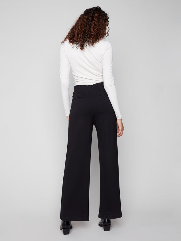 Mid-rise waist enhances the flattering fit of these stylish black wide-leg pants by Charlie B.