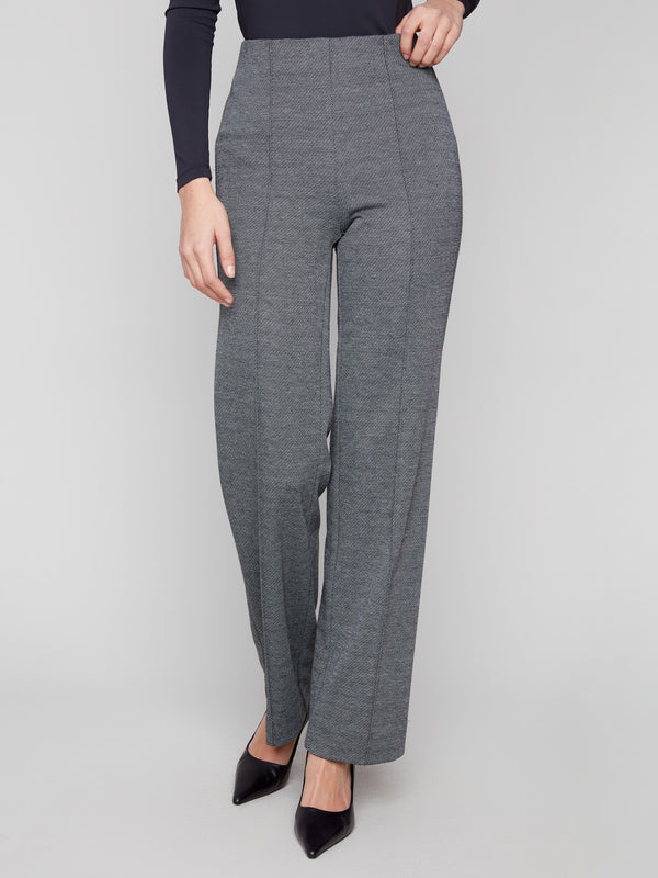 Long-length black pants featuring an elastic waist for comfort by Charlie B.