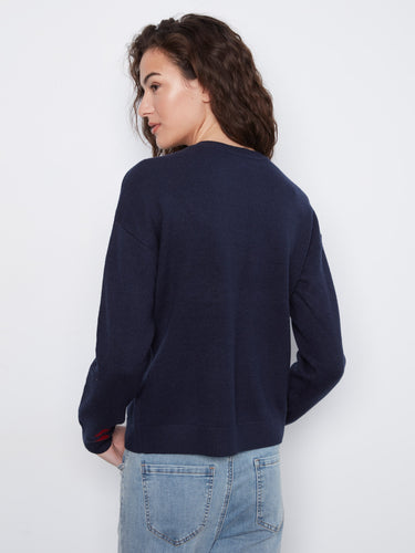 Sophisticated navy sweater designed with drop shoulders and bold heart motifs in red, creating a standout piece by Charlie B.