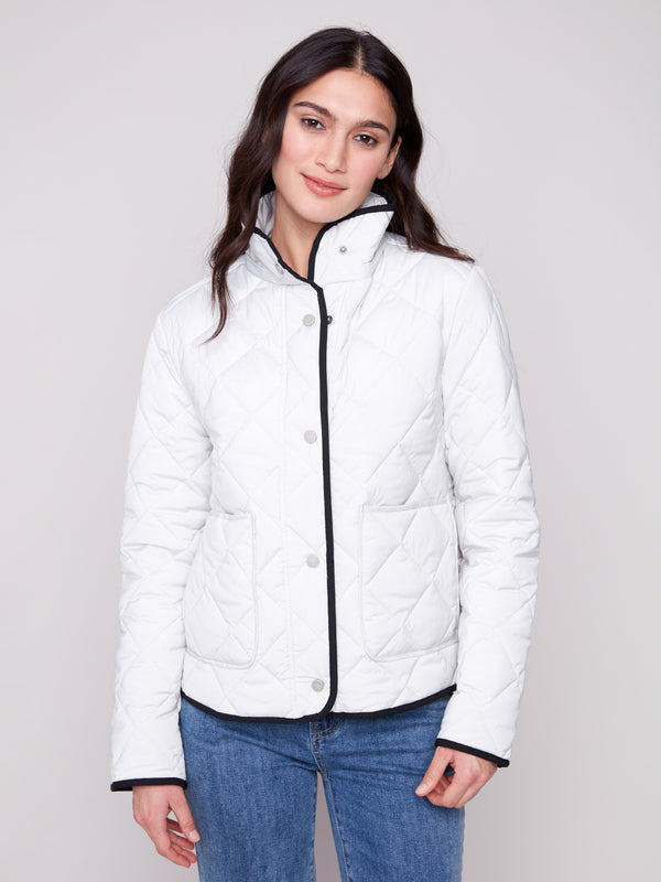 Cozy quilted jacket showcasing a modern high collar design by Charlie B.