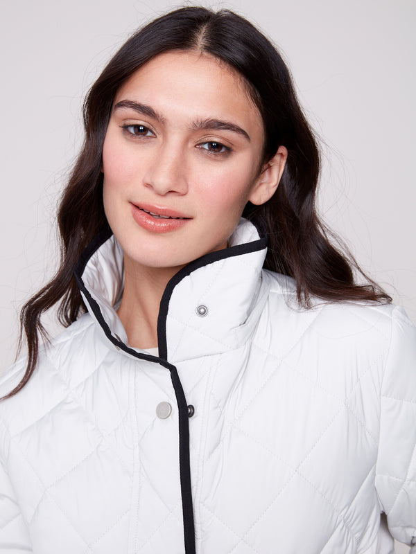Fashionable almond puffer featuring side patch pockets for convenience by Charlie B.