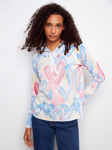 Elevate your casual wardrobe with this eye-catching, reverse print hoodie made from premium materials by Charlie B.