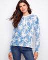 Blue palm tree hoodie featuring a unique reverse print design, perfect for casual outings. Made with soft fabric for comfort by Charlie B.