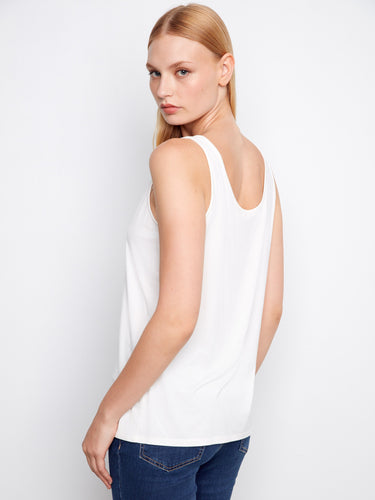 Trendy white tank top showcasing its reversible design with V-neck, offering effortless style in its relaxed fit by Charlie B.