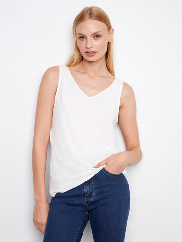 With its classic scoop neck design, this versatile piece is perfect for layering or wearing solo on warm days. Timeless fashion from Charlie B.