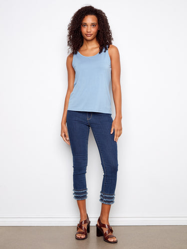 Designed with a scoop neck, this top provides a classic look that pairs well with any outfit. Perfect for versatile styling by Charlie B.