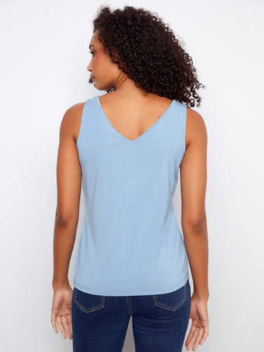 Crafted with both scoop neck and V-neck options, this top offers versatile styling choices to match your mood by Charlie B.