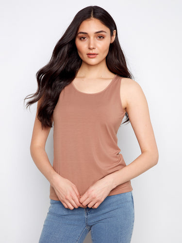Experience the versatility of a reversible design in this elegant piece, offering multiple styling options. Created by Charlie B.