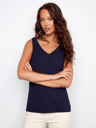 Elegant navy top with a stylish scoop neck, offering a relaxed fit for all-day comfort and style. Designed by Charlie B.
