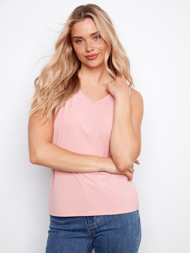 Scoop neck detailing adds to the allure of this versatile piece that can be worn with numerous outfits effortlessly. By Charlie B.