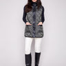 Spruce quilted vest with button front closure, showcasing a versatile reversible design by Charlie B.