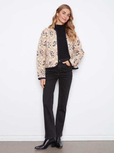 The quilted design of this jacket provides both comfort and warmth, perfect for cooler days by Charlie B.