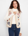 Floral embroidered sherpa vest with a crew neck and open-front design, perfect for layering by Charlie B.