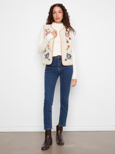 Chic sleeveless vest featuring floral embroidery on the sherpa side, ideal for casual outings by Charlie B.