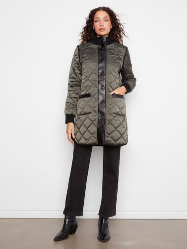 Green quilted puffer jacket featuring a reversible design and stylish patch pockets by Charlie B.