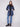 Reversible navy puffer jacket featuring snap buttons and cozy rib-knit cuffs for a versatile look by Charlie B.