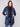 Stylish navy quilted design with side zipper details, perfect for layering in cooler weather by Charlie B.