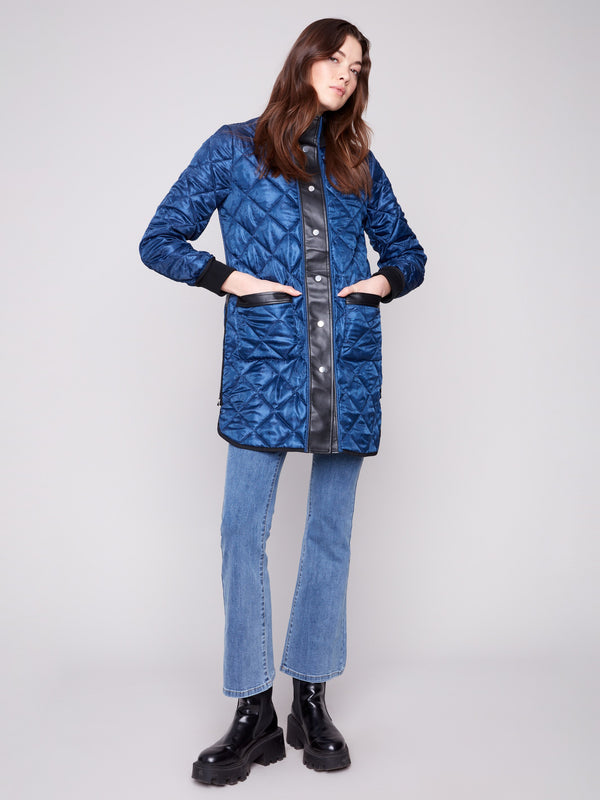 Quilted puffer jacket in navy with faux leather detailing, offering a chic outerwear option by Charlie B.