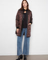 Quilted coat with a stand collar, featuring a sleek snap-button closure for added style and functionality by Charlie B.