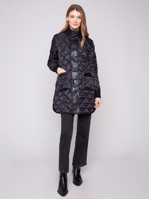Black quilted puffer jacket featuring rib knit detailing and two front patch pockets by Charlie B.